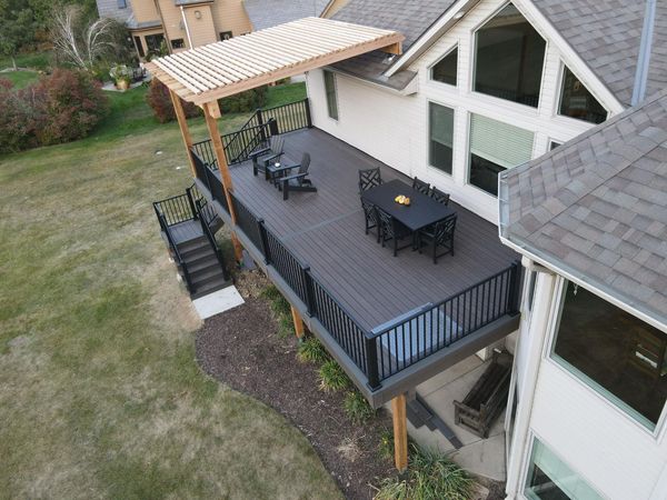 Two-tier TimberTech deck with glass panel railing and recessed LED lighting, Omaha, NE