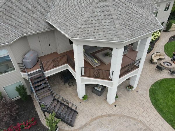 Elevated composite deck with pergola, privacy screen, and string lights, Gretna, NE