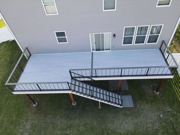 Covered composite deck with recessed lighting and glass panel railing, Elkhorn, NE