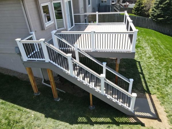 TimberTech composite deck with hidden fasteners, picture-frame border, and black powder-coated railing, Omaha, NE