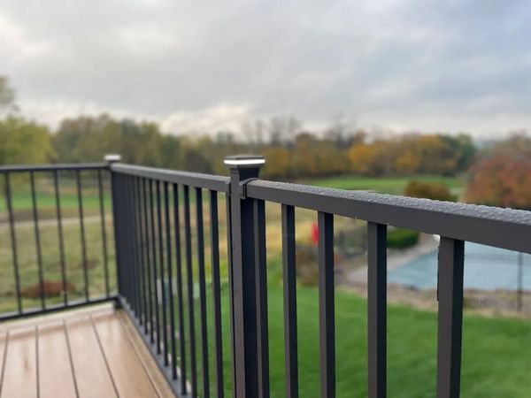 Wide Trex Transcend deck with metal balusters, decorative post caps, and built-in bench, La Vista, NE