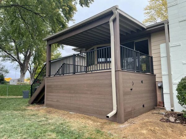 TimberTech Legacy deck with custom pergola, privacy side walls, and stainless cable railing, Bellevue, NE