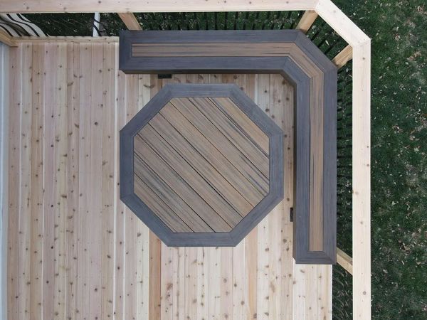 Single-level cedar deck with natural oil finish and decorative black metal railing, Omaha, NE