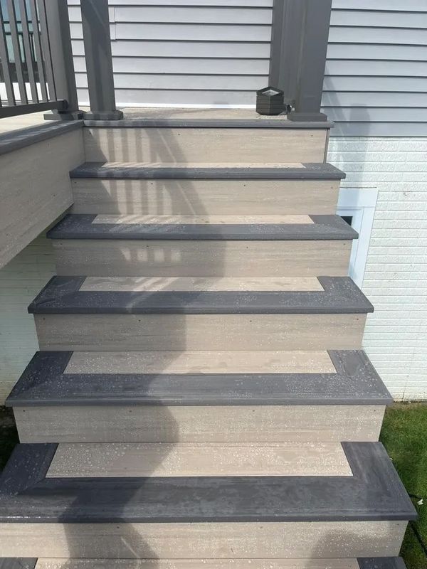 Composite deck with pergola, suspended swing bed, and recessed deck lighting, Omaha, NE