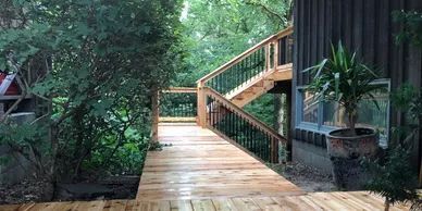 Composite deck with cedar accent trim, outdoor kitchen rough-in, and custom pergola, Omaha, NE