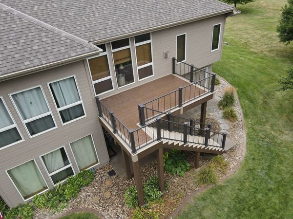Single-level cedar deck with white-painted railing and flower box integrated at the top rail, Omaha, NE
