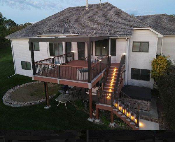 Large composite deck with covered porch section, ceiling fan, and stainless cable railing system, Omaha, NE