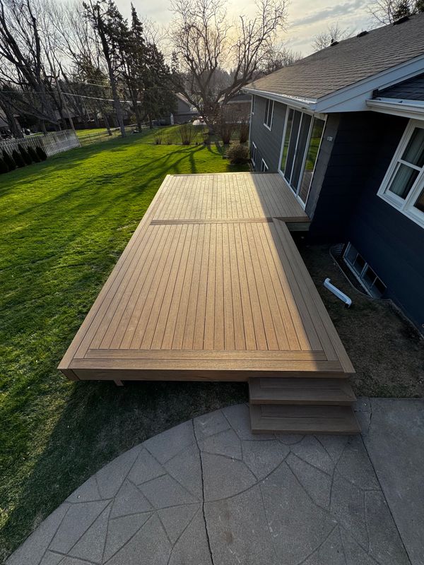 Large multi-level Trex composite deck with full-height privacy screen and aluminum post railing, Bellevue, NE