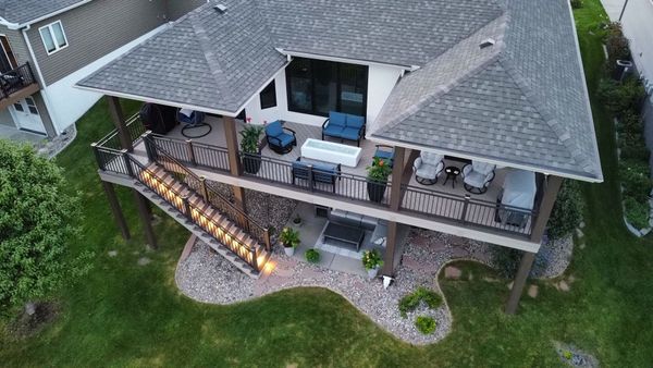 Composite deck with fire pit cutout, surrounding bench seating, and aluminum post-and-rail, Omaha, NE