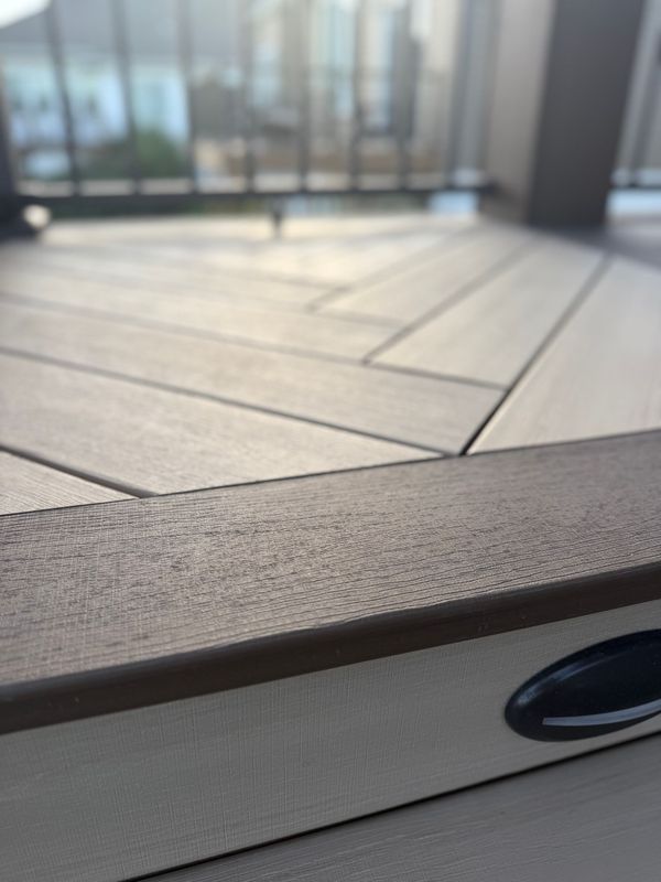 Multi-level combination cedar and composite deck with black railing and accent step lighting, Council Bluffs, IA